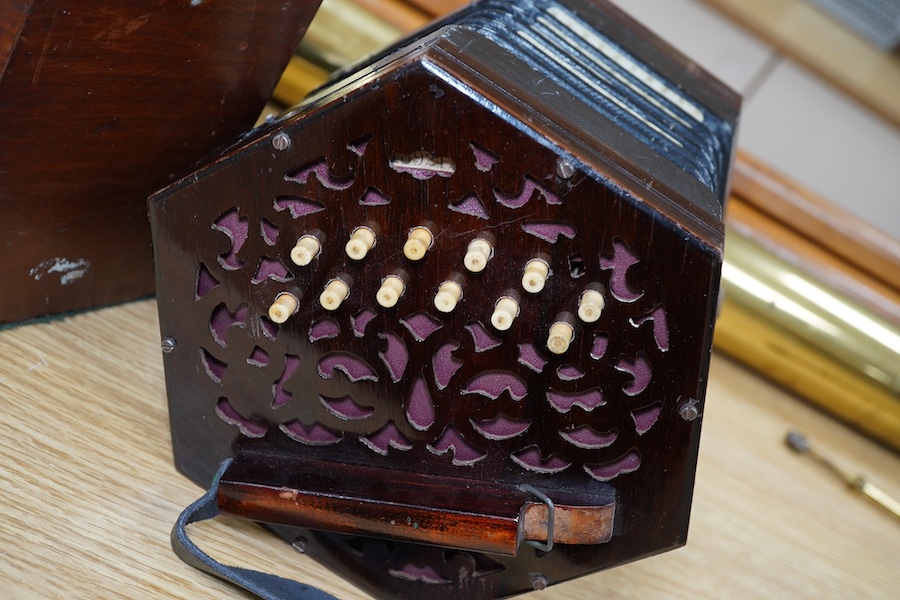 A mid-19th century Lachenal & Co., London mahogany concertina, in an hexagonal mahogany case. Condition - fair to good, the leatherwork on the bellows appears sound and strong.